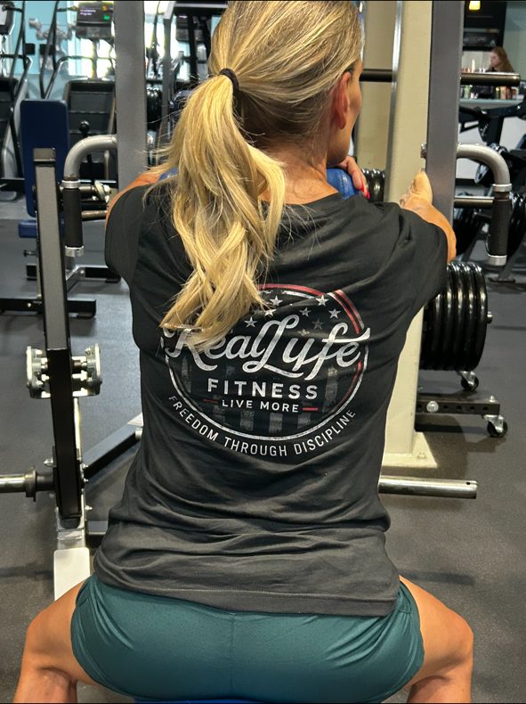 Jacqui training in her Real Lyfe Fitness tee